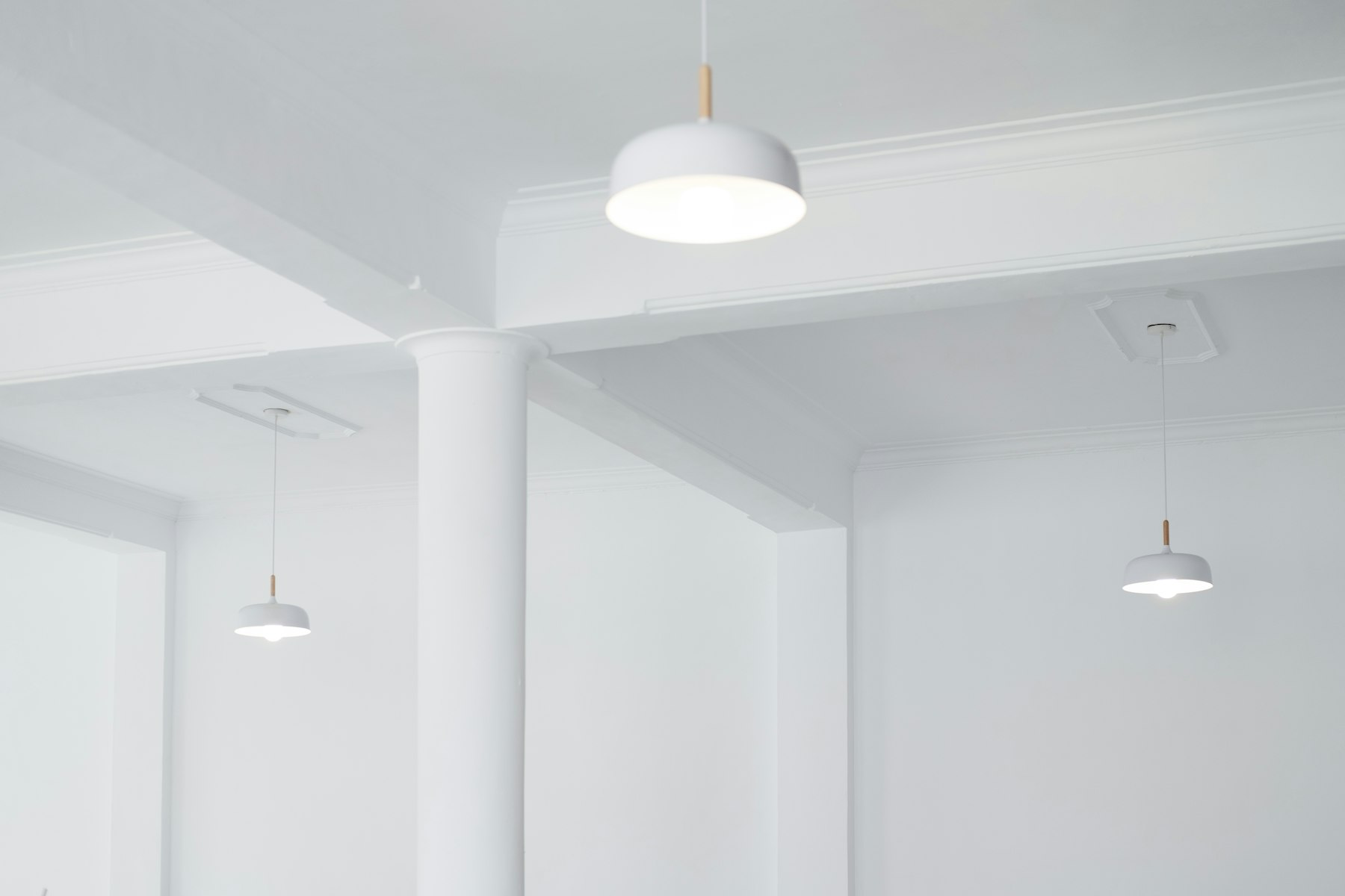 Grey pendant lights hanging from a ceiling